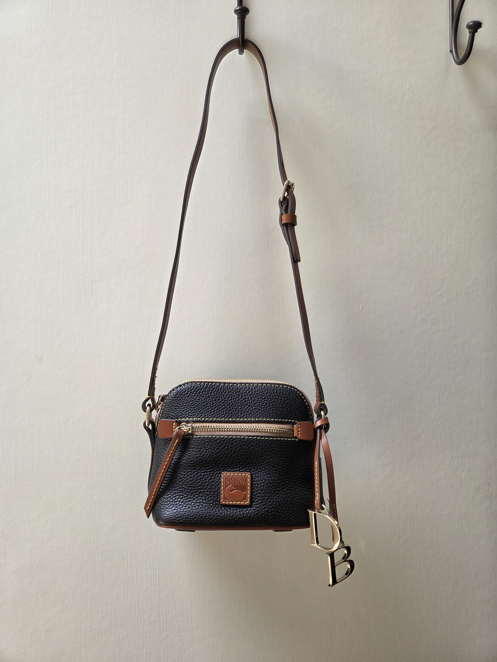 Dooney & Bourke NWT Black Pebble Leather Crossbody with Brown Trim. Logo charms